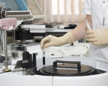 doctor preparing lab material for tests