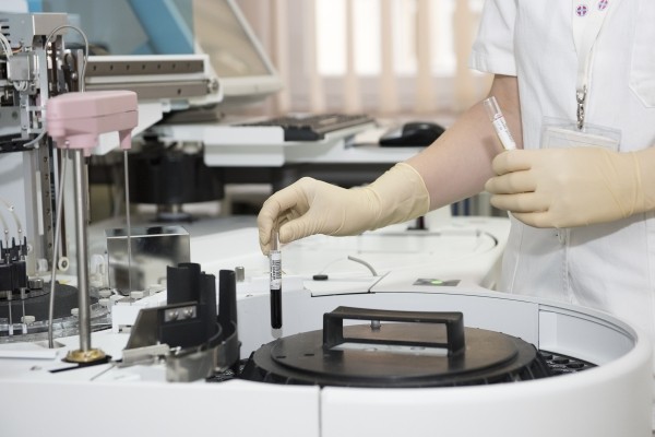 doctor preparing lab material for tests