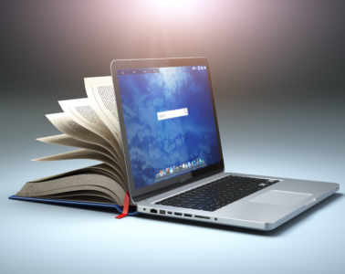 Online Library Or E Learning Concept. Open Laptop And Book Compilation.